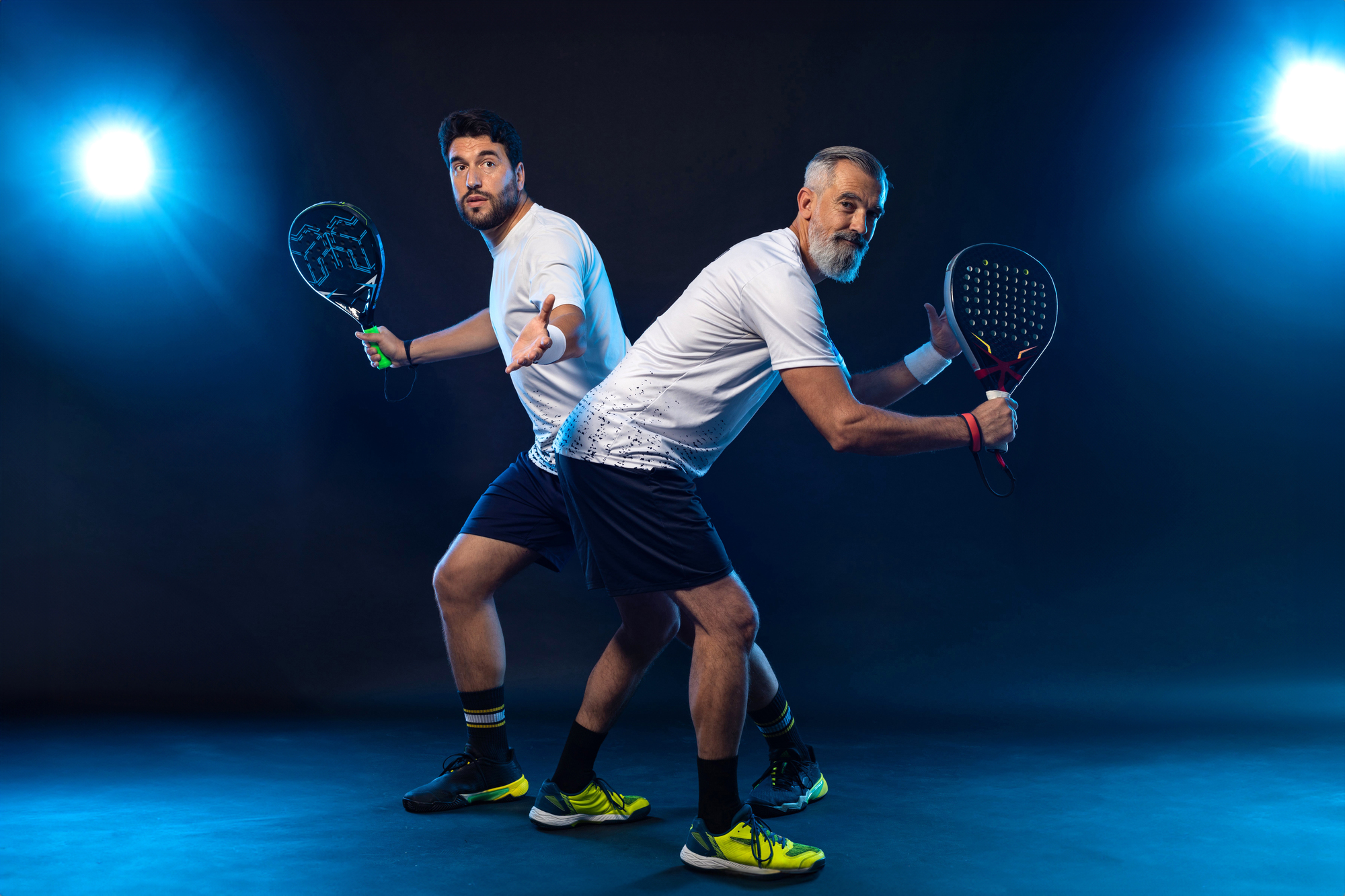 Padel Tennis Doubles. Two Athletes Players With Racket. Man Athlete With Paddle Racket On Court With Neon Colors. Sport Concept. Download A High Quality Photo For The Design Of A Sports App