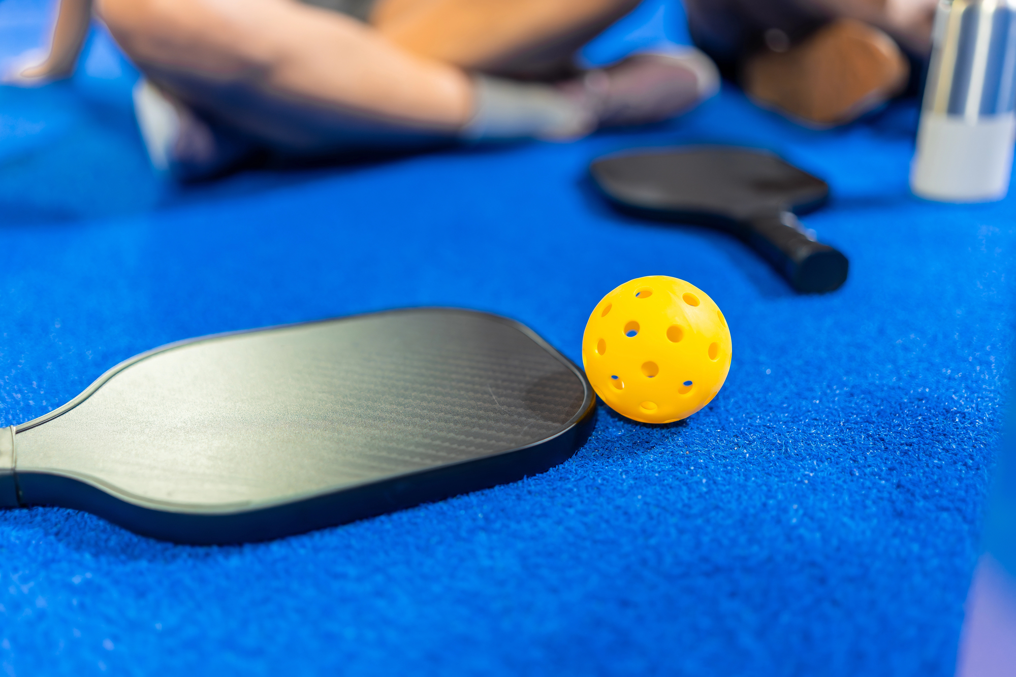 Yellow Pickleball Paddles Resting Blue Depositphotos 869312392 L